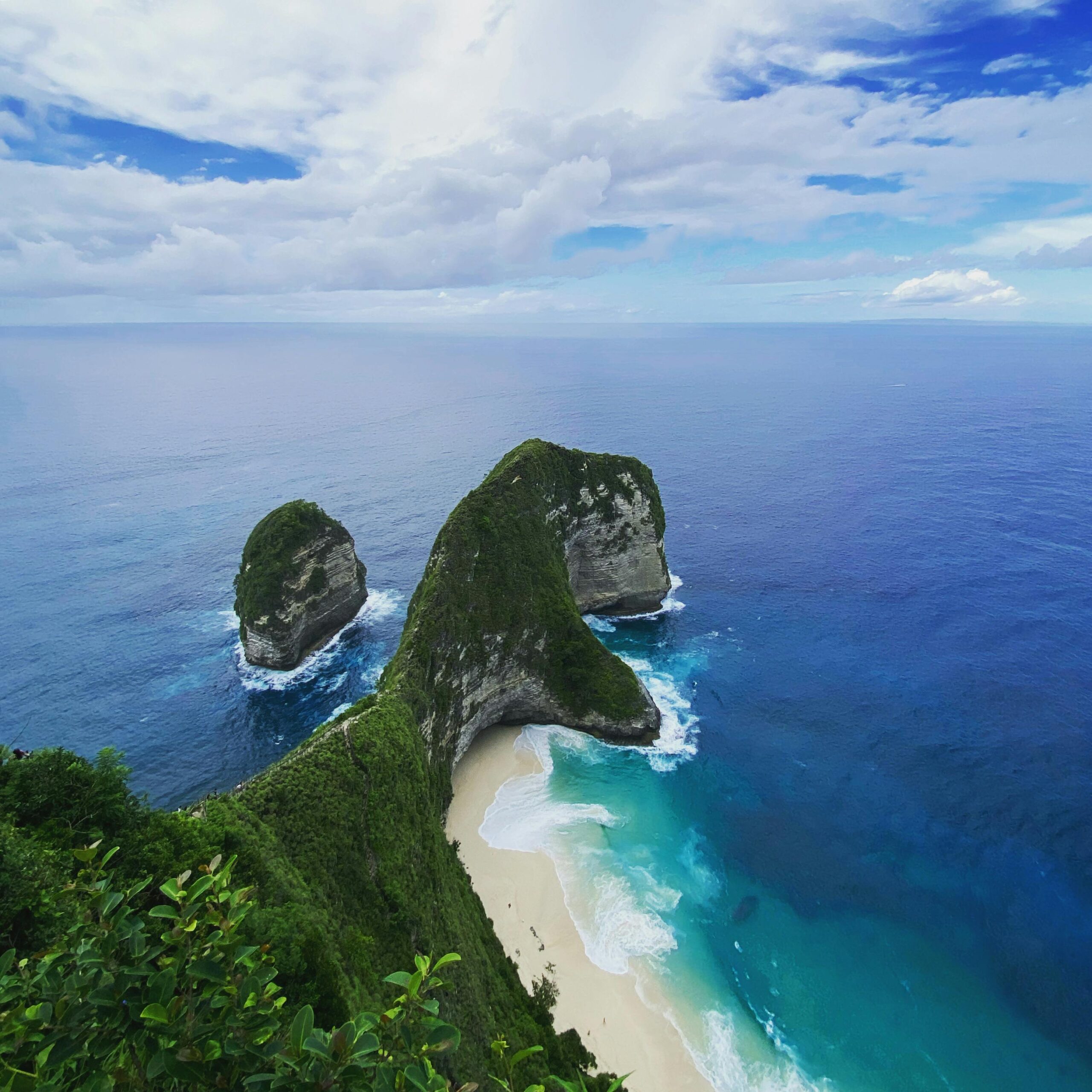 Experience the breathtaking beauty of Kelingking Beach in Bali with its iconic rock formations and pristine waters.