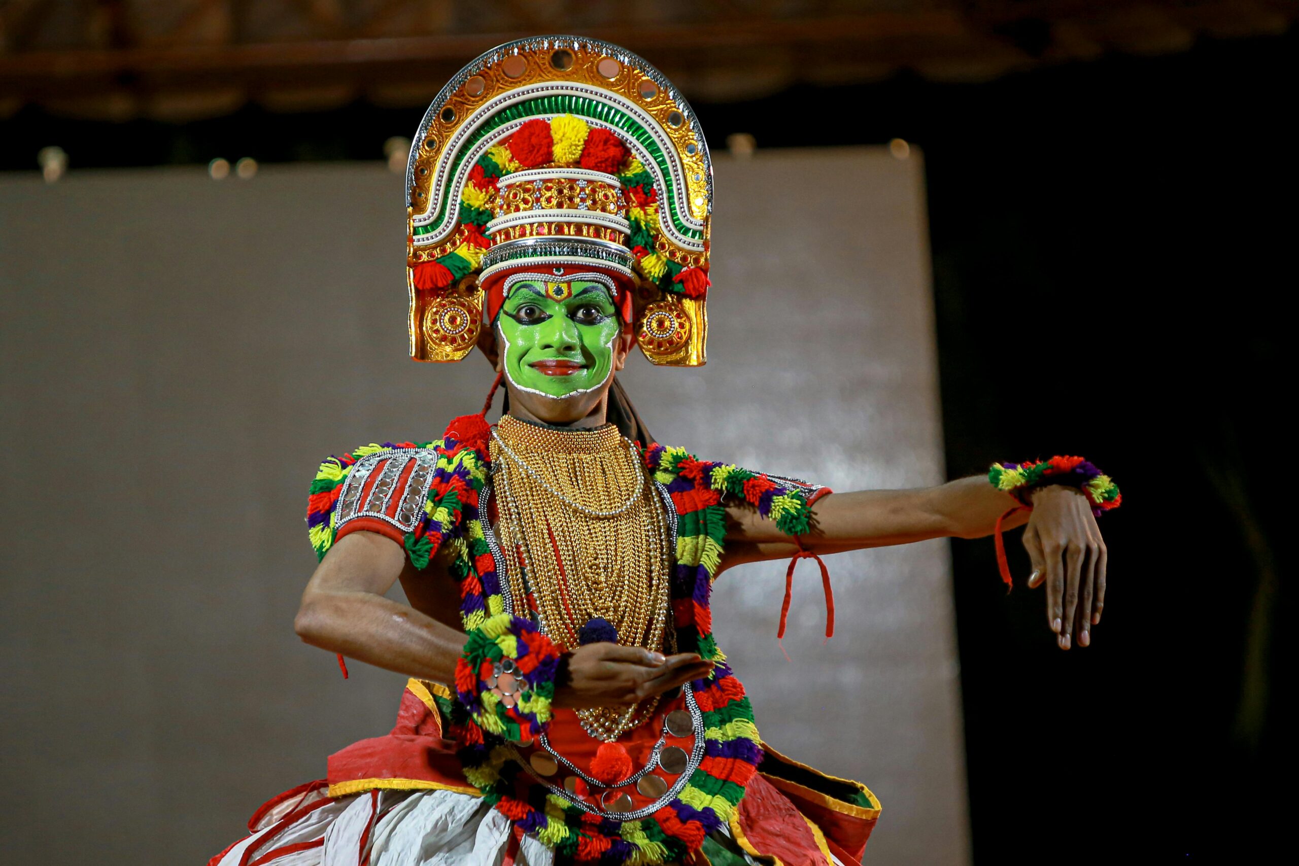 Vibrant Kathakali dancer in traditional costume performing in Kerala, India.
